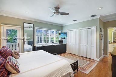 113 South Gordon Road Fort Lauderdale, FL 33301 - Photo 35 of 53 a bedroom with a large bed and a large window