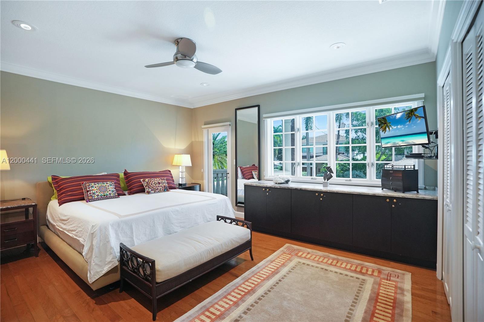113 South Gordon Road Fort Lauderdale, FL 33301 - Photo 36 of 53 a bedroom with a bed and a large window