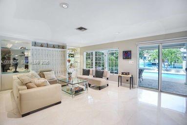 113 South Gordon Road Fort Lauderdale, FL 33301 - Photo 6 of 53 a living room with furniture and a large window