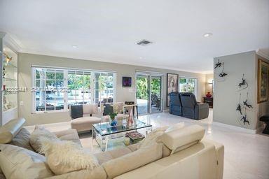 113 South Gordon Road Fort Lauderdale, FL 33301 - Photo 7 of 53 a living room with furniture and a large window