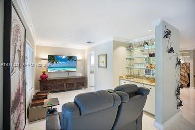 113 South Gordon Road Fort Lauderdale, FL 33301 - Photo 9 of 53 a living room with furniture and a flat screen tv