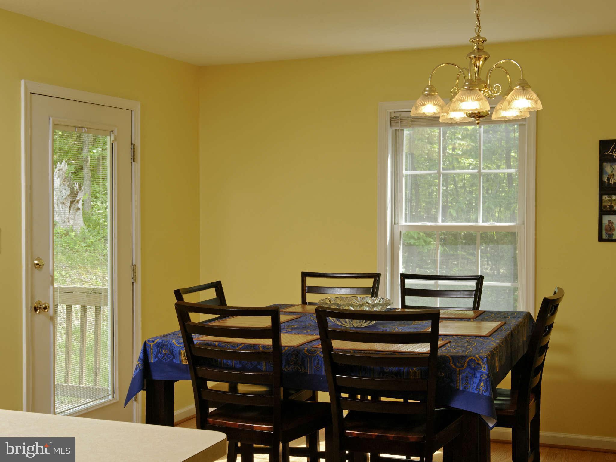 5002 Howellsville Road Front Royal, VA 22630 - Photo 3 of 21 a view of a dining room with furniture and chandelier
