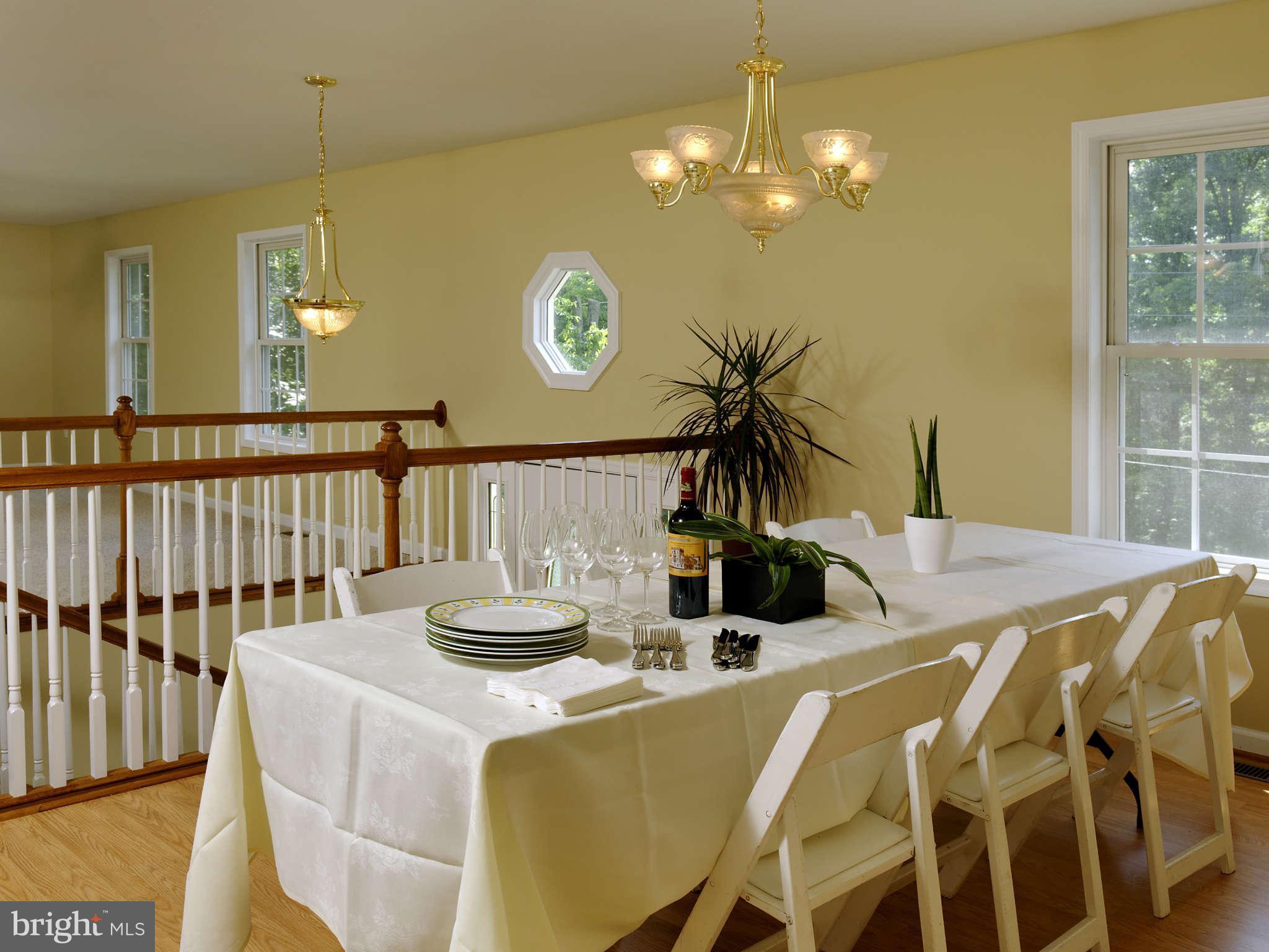 5002 Howellsville Road Front Royal, VA 22630 - Photo 4 of 21 a view of a dining room with furniture and chandelier