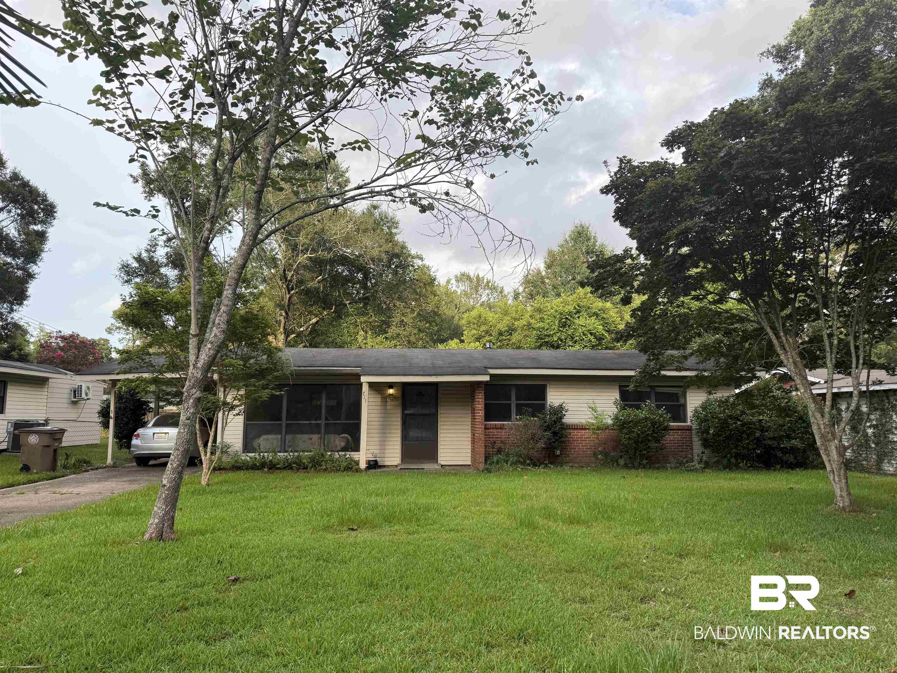 711 Wilshire Road Mobile, AL 36609 - Photo 1 of 11 Single-story home featuring a combination of siding and brick veneer