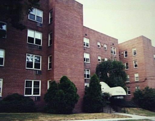 45 Maple Street, Unit 1D Norwalk, CT 06850 - Photo 1 of 1 a view of a brick building next to a yard