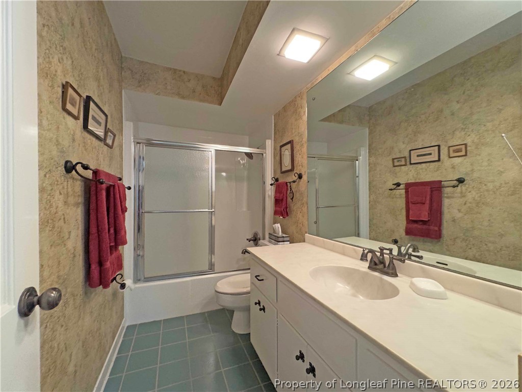 190 Palmetto Road Pinehurst, NC 28374 - Photo 15 of 19 a bathroom with a double vanity sink mirror and shower