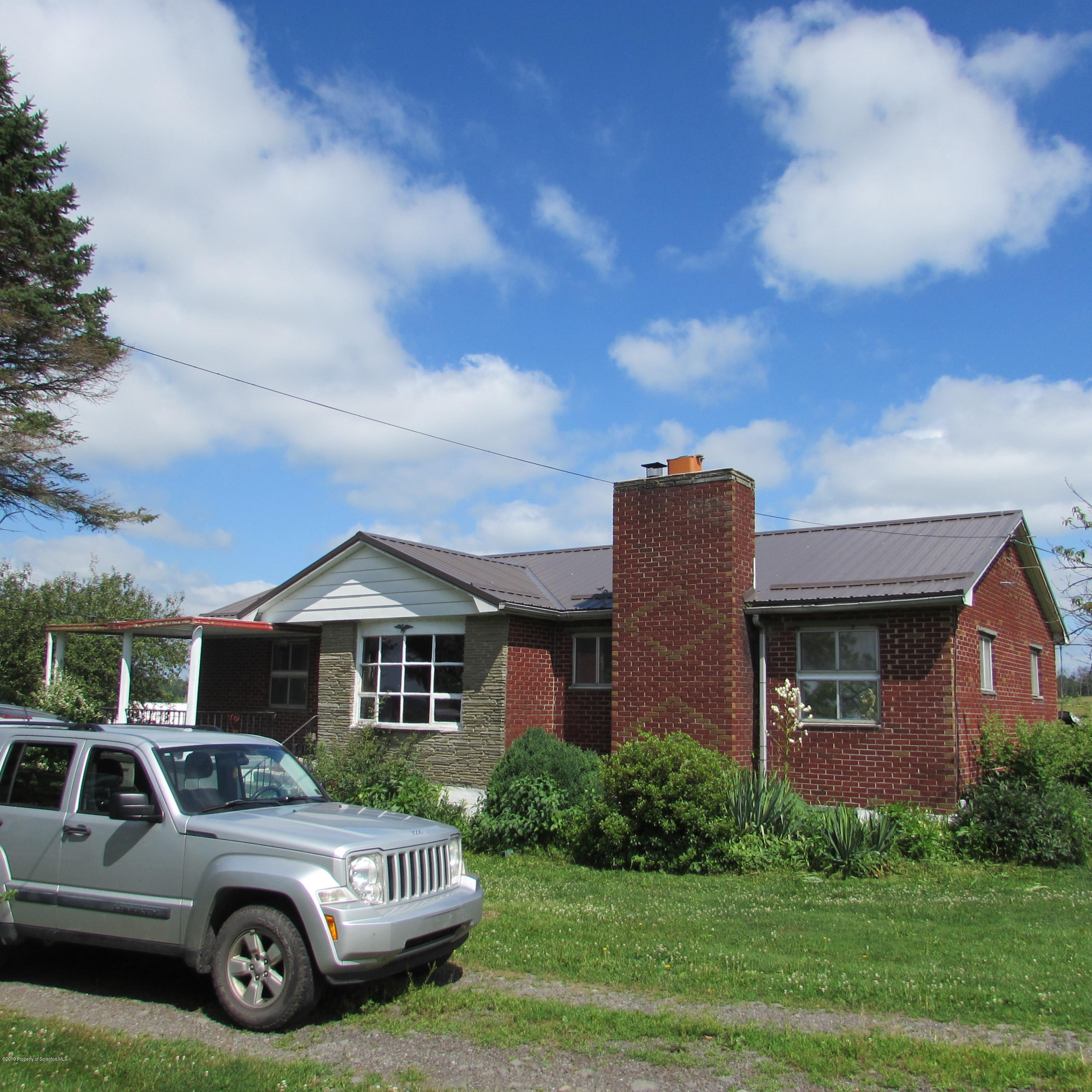 171 Sawmill Road Tunkhannock, PA 18657 - Photo 2 of 20 a car parked in front of a house