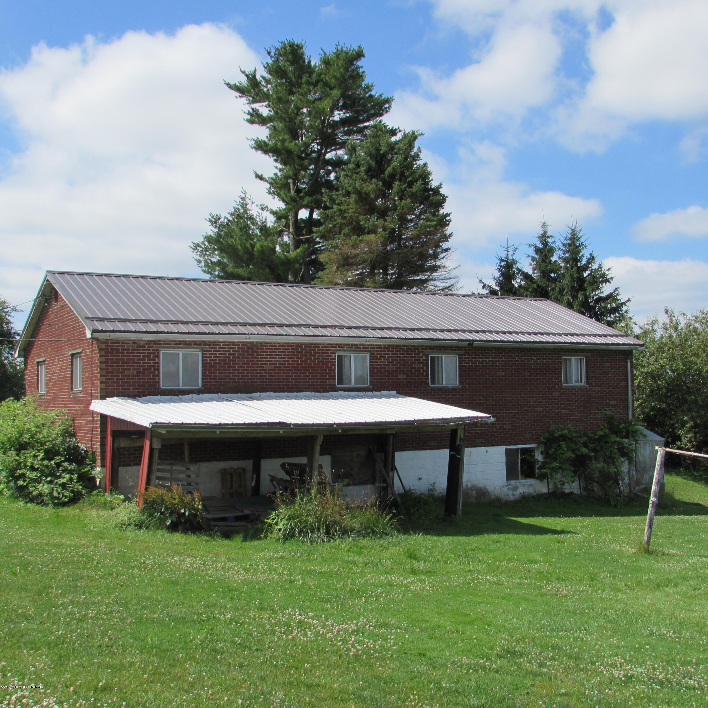 171 Sawmill Road Tunkhannock, PA 18657 - Photo 4 of 20 a backyard of a house with table and chairs
