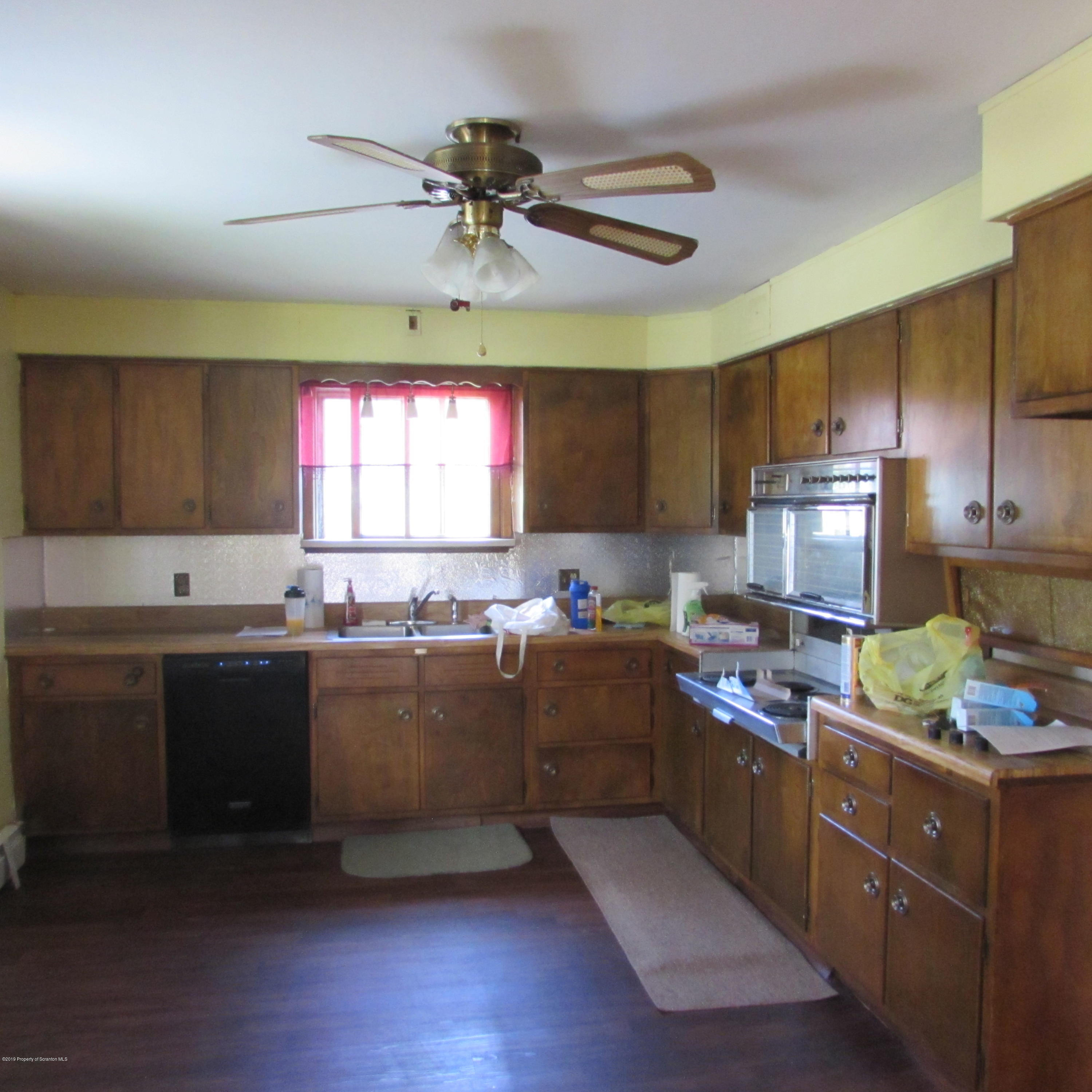 171 Sawmill Road Tunkhannock, PA 18657 - Photo 8 of 20 a kitchen with kitchen island granite countertop a sink cabinets and stainless steel appliances