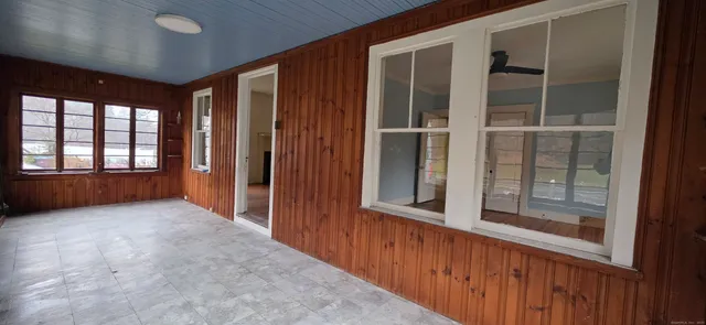 a view of an empty room with a window