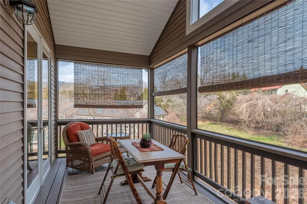 a view of a two chairs in the balcony