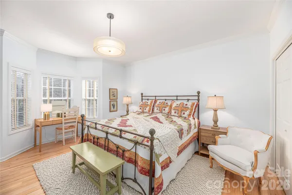 a bed room with a bed and furniture