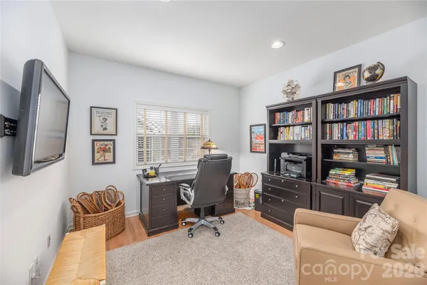 a view of a livingroom with workspace and a couch