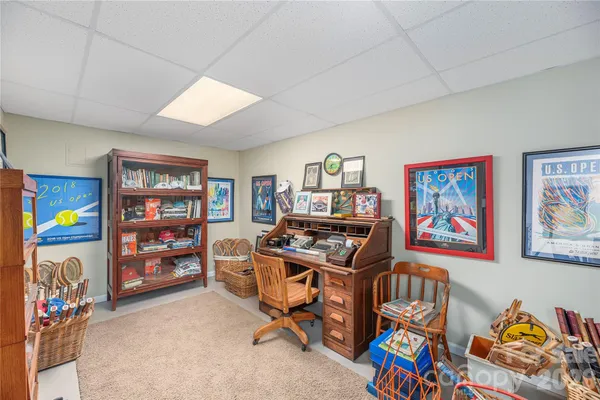 a view of a workspace with furniture and toys