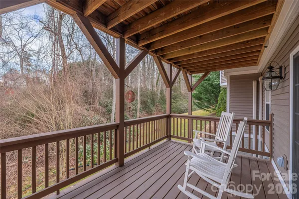 a view of balcony with wooden floor