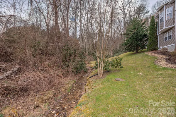 a view of backyard with green space