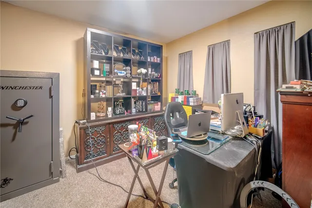 a view of a workspace with furniture