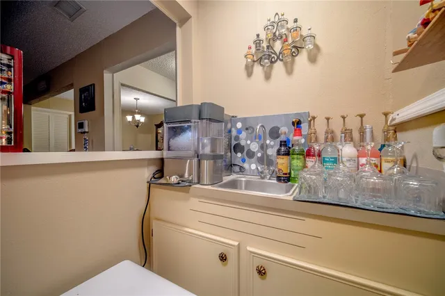 a bathroom with a sink mirror vanity and toilet