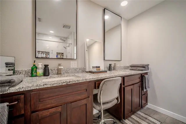 a sink with granite countertop a sink and cabinets