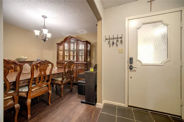 a view of a livingroom with furniture and hardwood floor