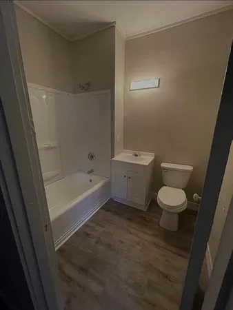 a bathroom with a toilet a sink and a bathtub