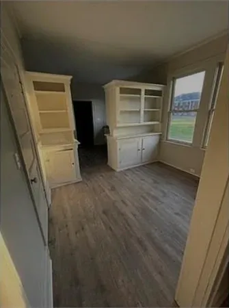 a view of an empty room and a window
