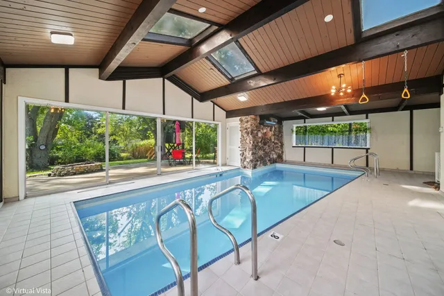 a view of a swimming pool with a patio