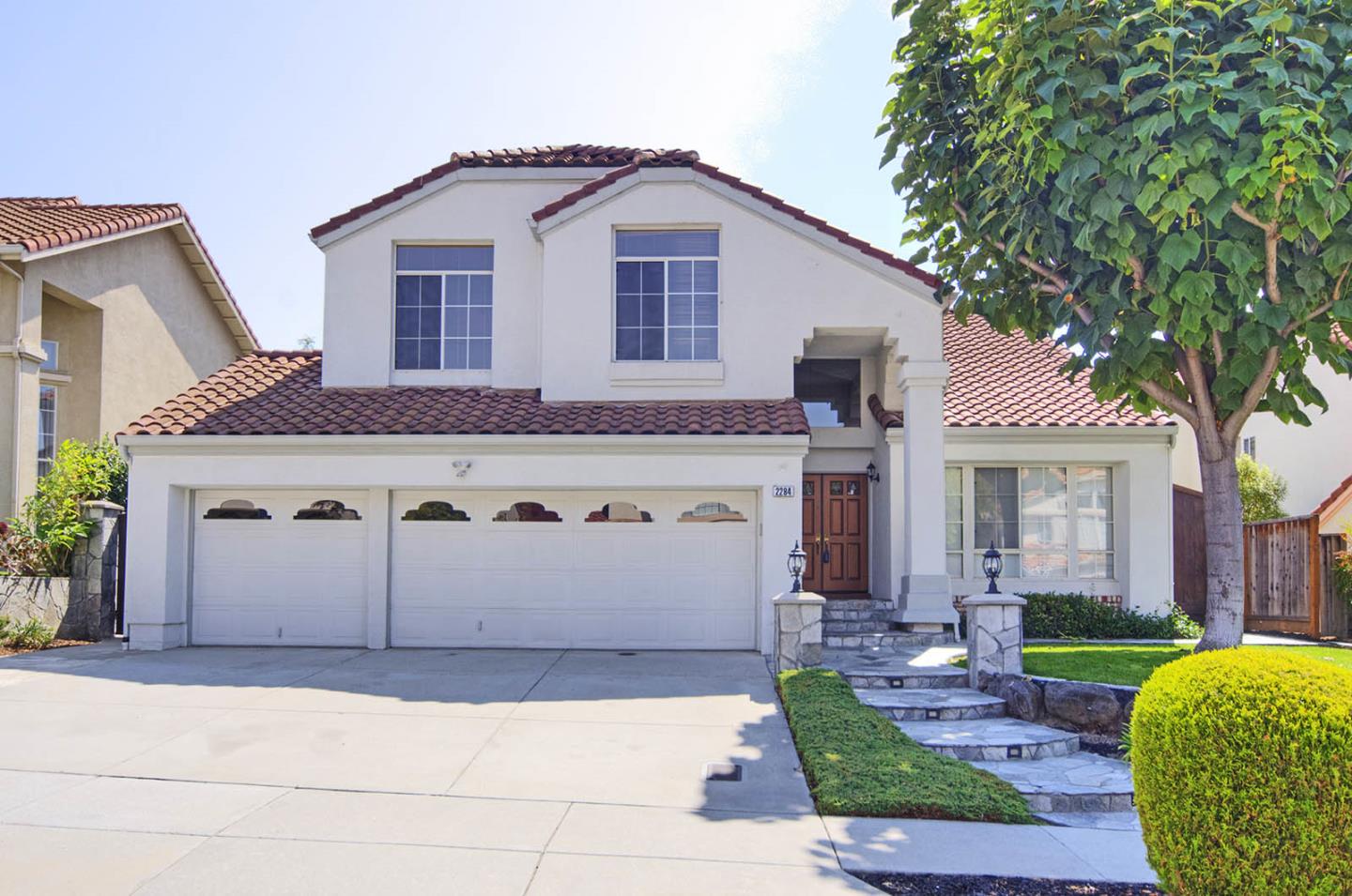 2284 Skyline Drive Milpitas, CA 95035 - Photo 1 of 35 a front view of a house with a garden and garage