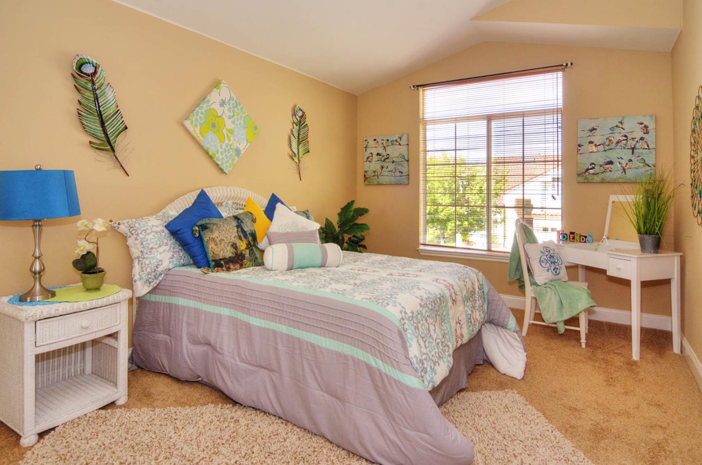 2284 Skyline Drive Milpitas, CA 95035 - Photo 25 of 35 a bedroom with a bed a table and painting on the wall