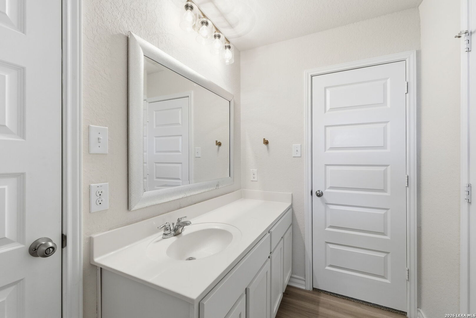 3410 Copper Acres Bulverde, TX 78163 - Photo 33 of 50 a bathroom with a sink and a mirror