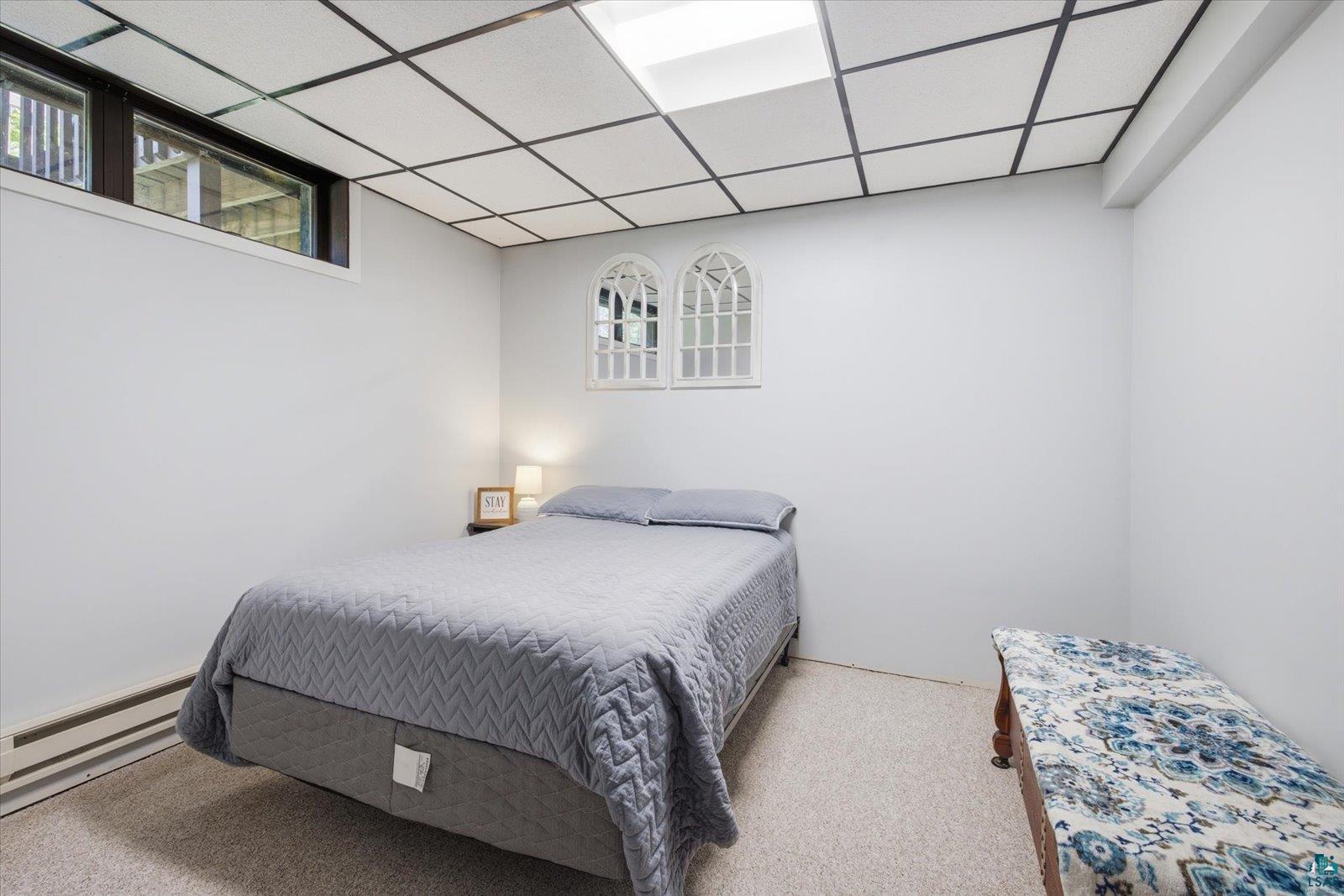 6377 Bergstrom Road Saginaw, MN 55779 - Photo 17 of 20 Room with light-colored walls, light-colored carpet, and a drop ceiling with dark grid