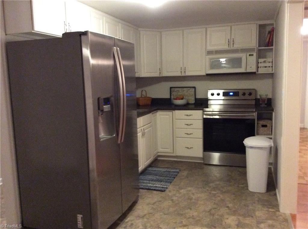 521 Cemetery Street Ronda, NC 28670 - Photo 4 of 13 Updated kitchen and all appliances will stay with the home.