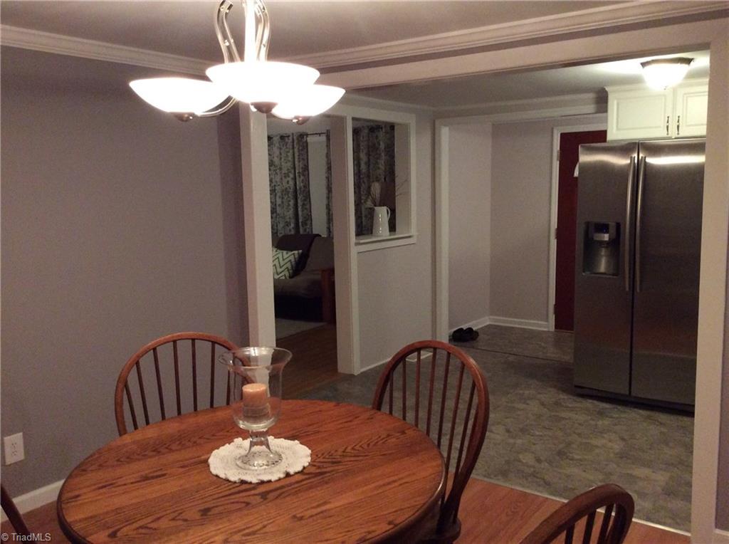 521 Cemetery Street Ronda, NC 28670 - Photo 6 of 13 Looking across dining to kitchen, front entry, and living room.