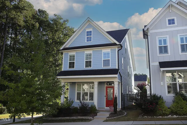 a front view of a house with garden