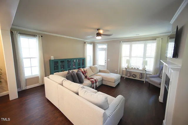 a living room with furniture and a fireplace