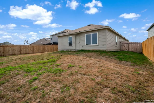 a view of a backyard with potted plants
