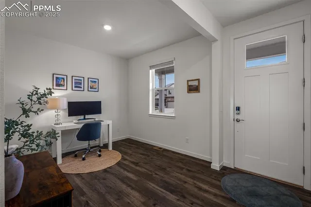 a workspace with furniture and wooden floor