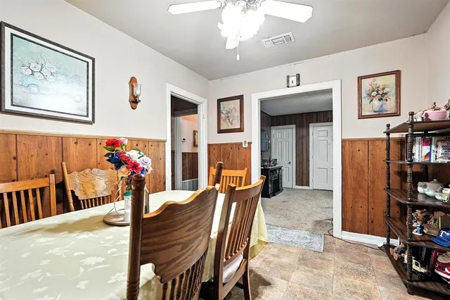 a view of a livingroom with furniture and cabinet