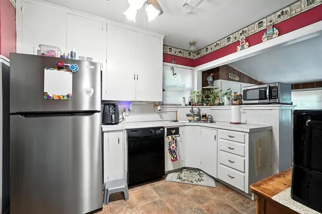 a bedroom with furniture and a chandelier
