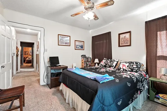 a bedroom with bed and a tv