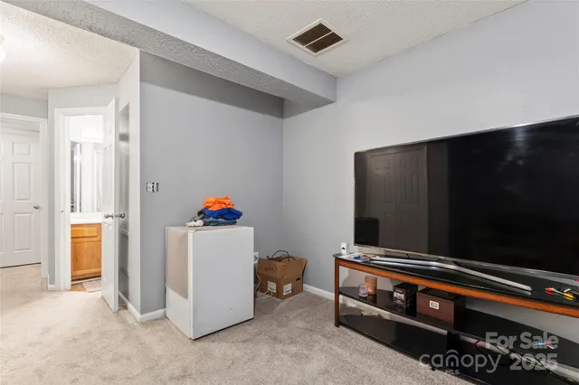 a room with furniture and a flat screen tv