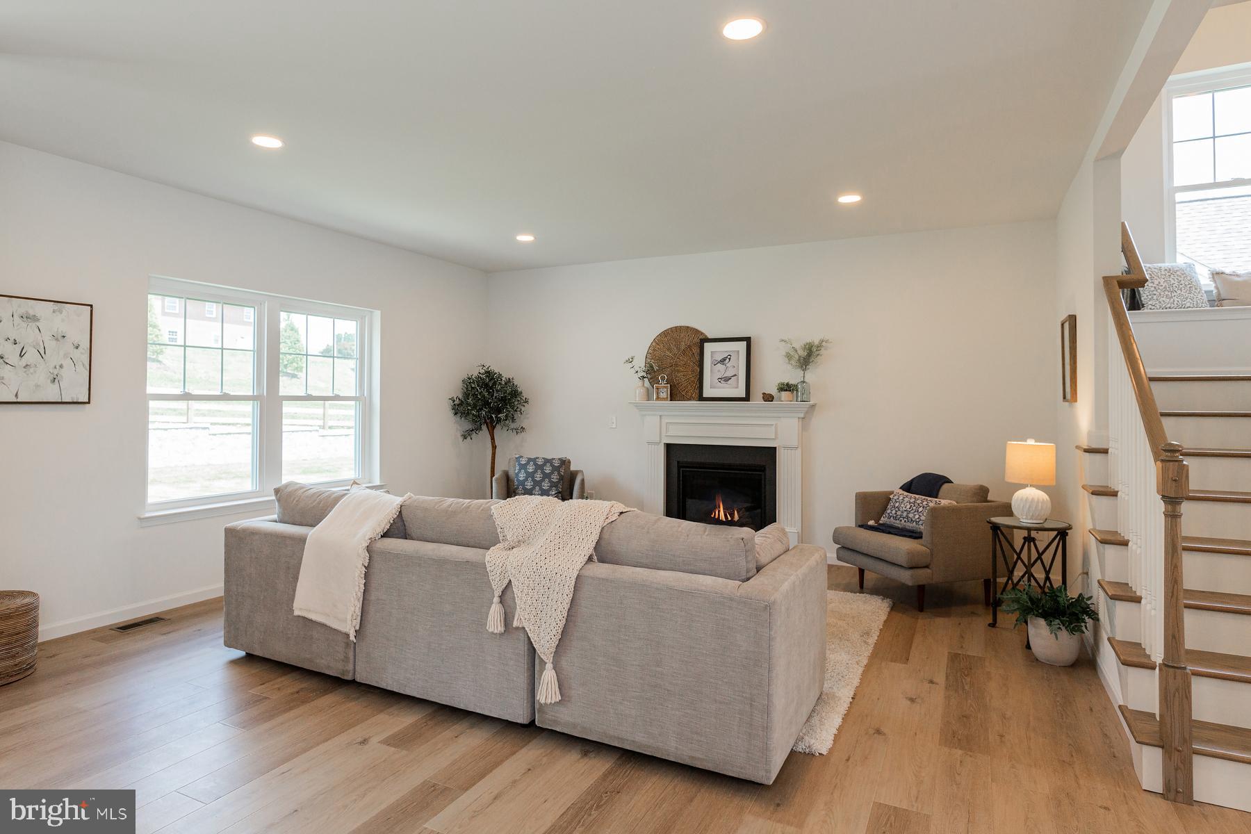 10 Ridgewood Road Quarryville, PA 17566 - Photo 12 of 48 a living room with furniture and a fireplace