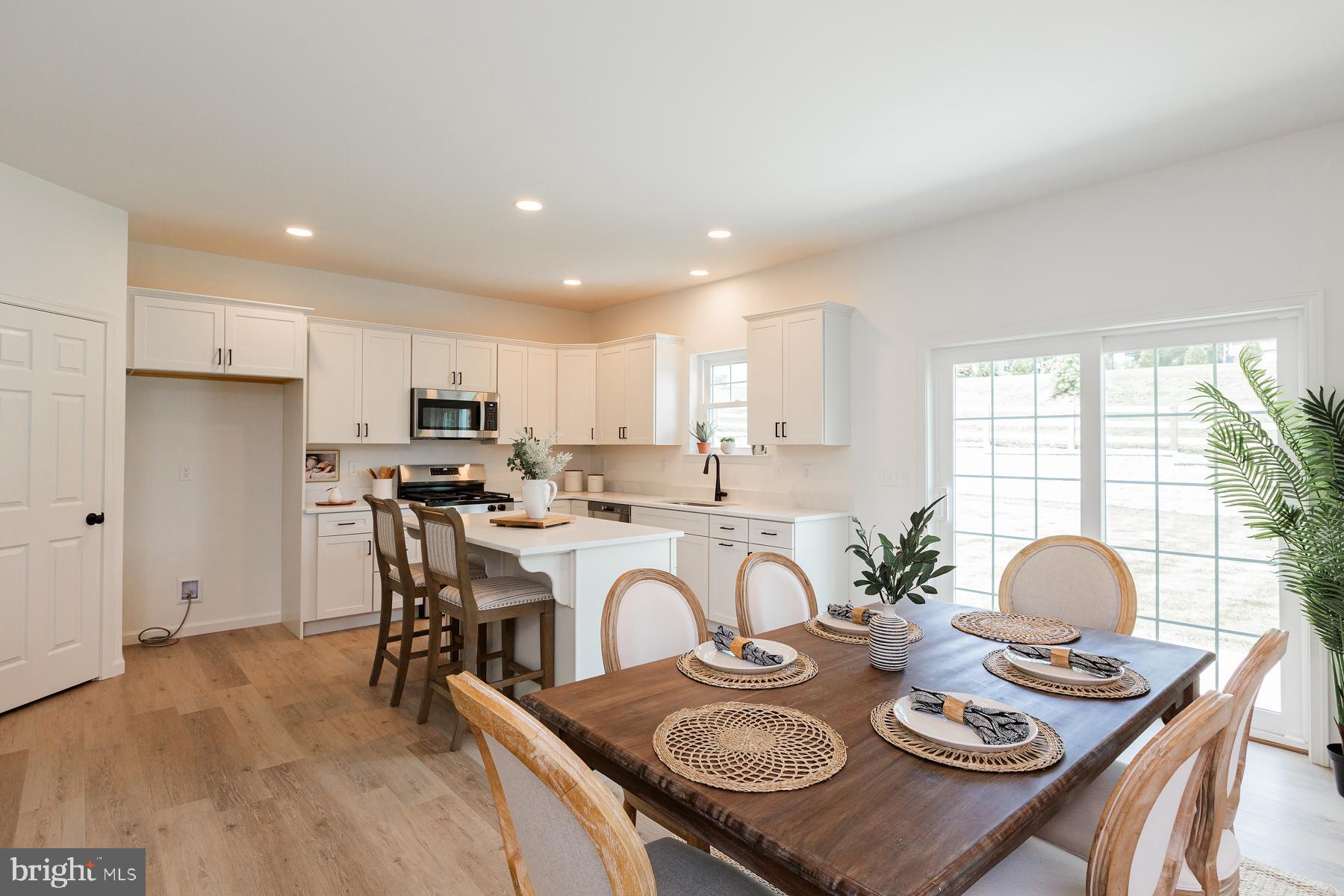 10 Ridgewood Road Quarryville, PA 17566 - Photo 15 of 48 a view of a dining room and kitchen with a table chairs
