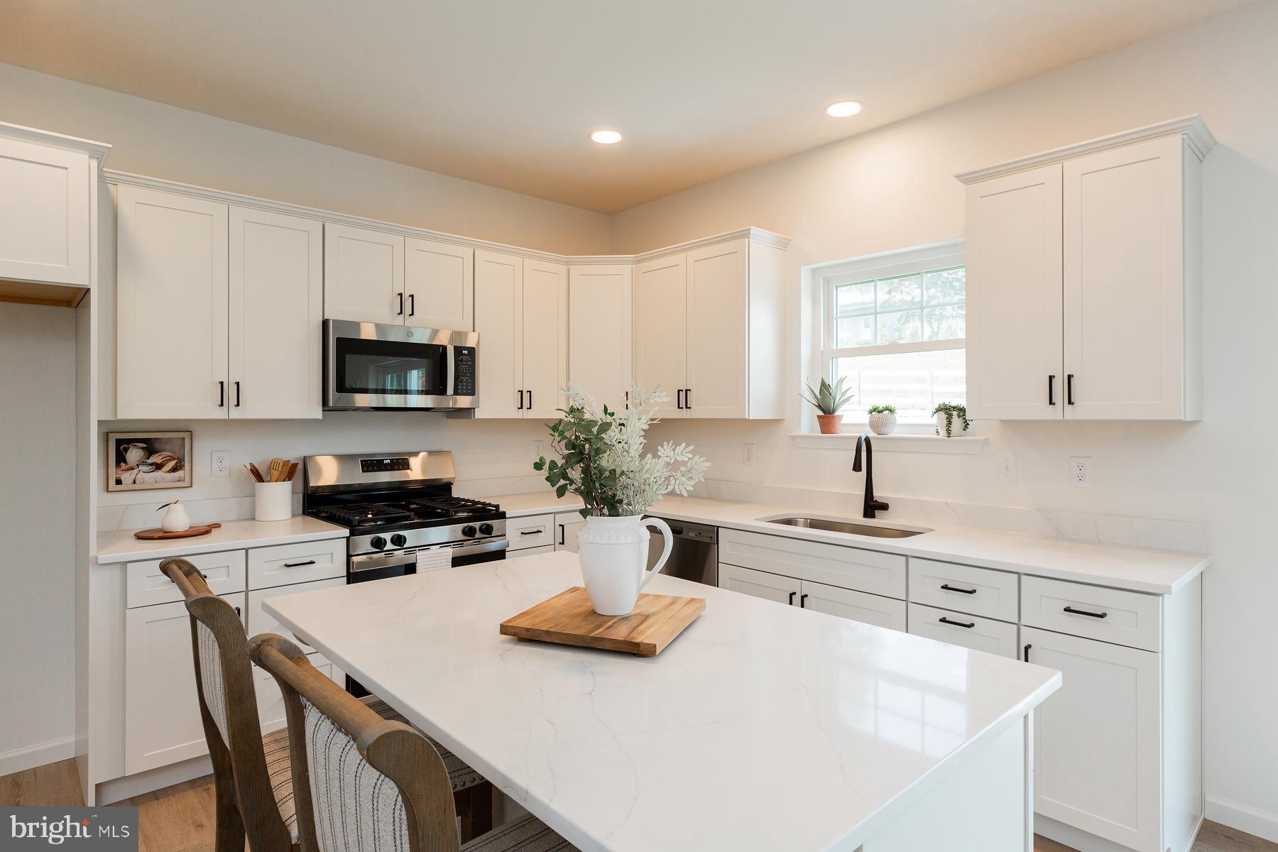 10 Ridgewood Road Quarryville, PA 17566 - Photo 16 of 48 a kitchen with appliances a sink and cabinets