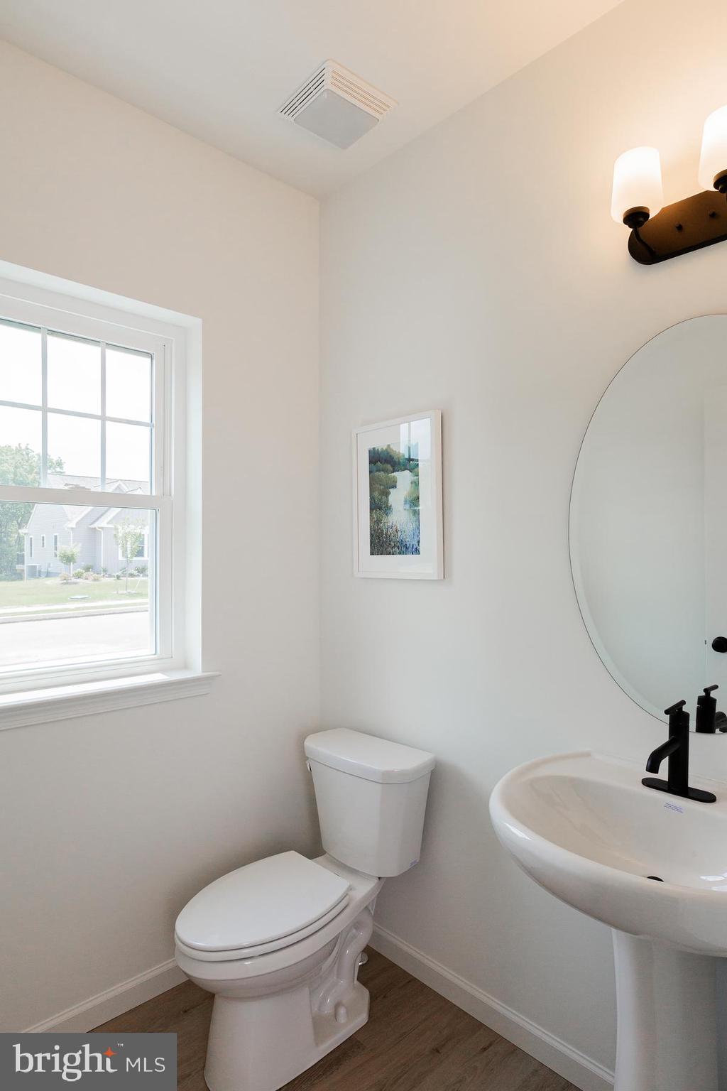 10 Ridgewood Road Quarryville, PA 17566 - Photo 25 of 48 a bathroom with a toilet a sink and a window