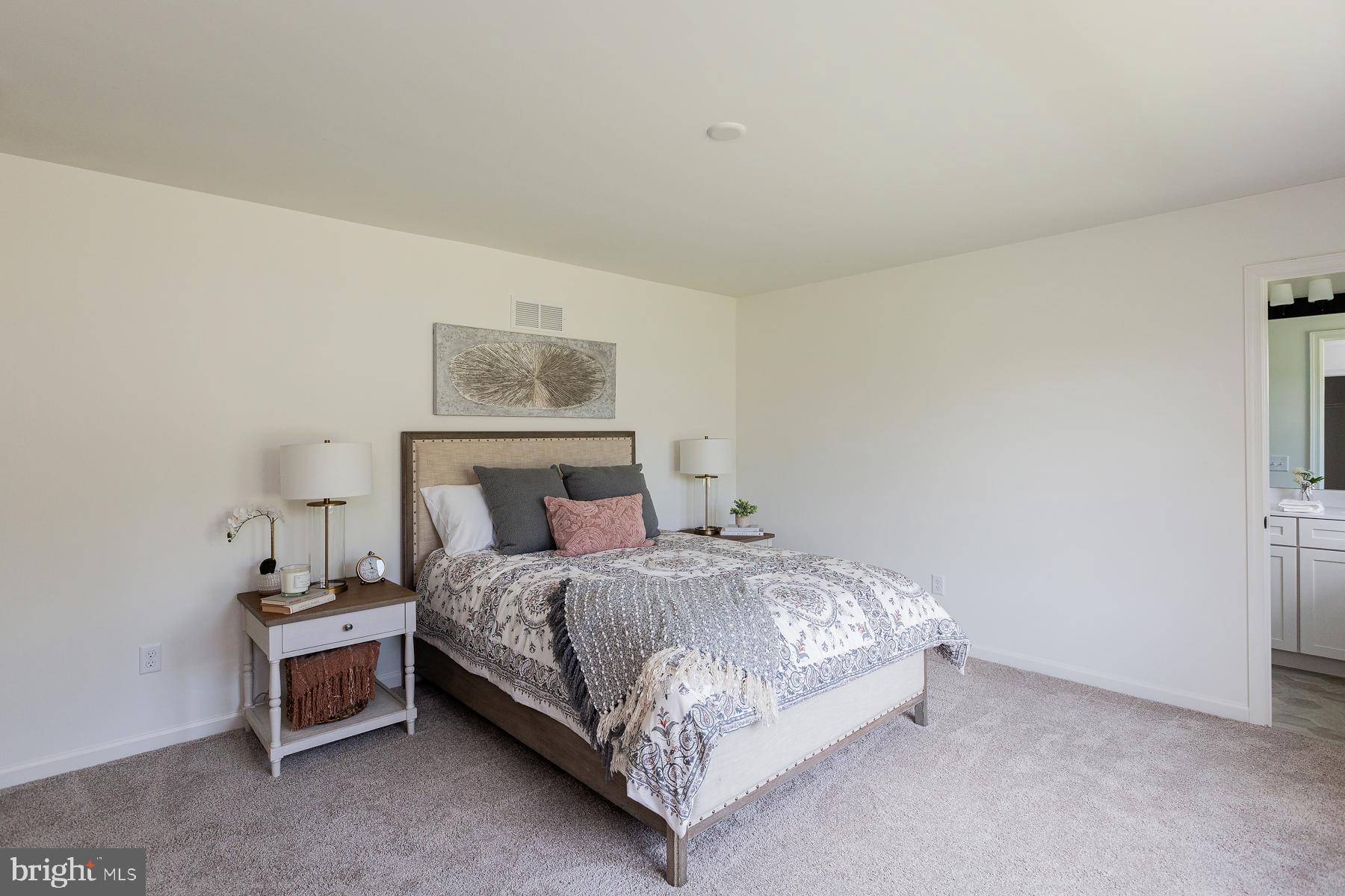 10 Ridgewood Road Quarryville, PA 17566 - Photo 27 of 48 a bed room with a bed and a lamp