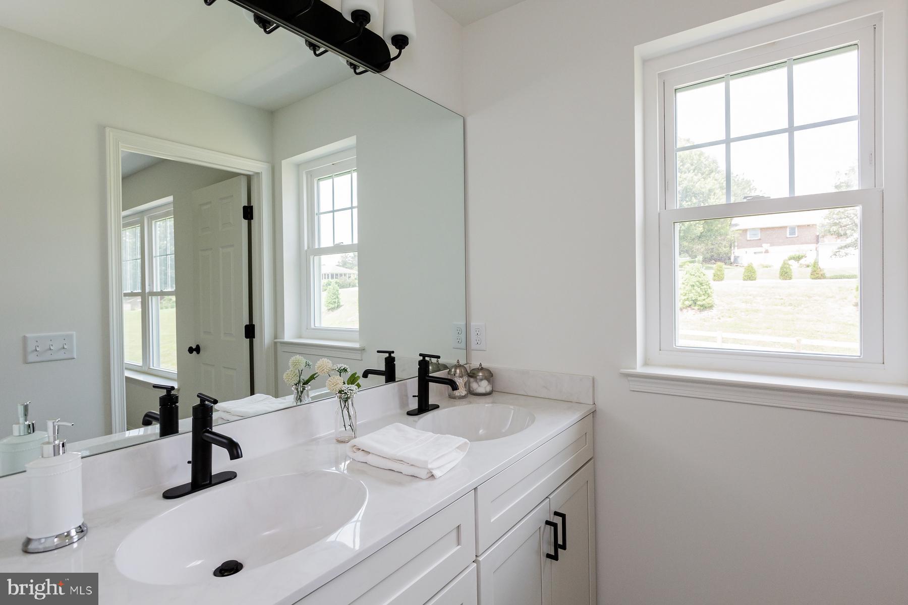 10 Ridgewood Road Quarryville, PA 17566 - Photo 31 of 48 a bathroom with a sink and a mirror