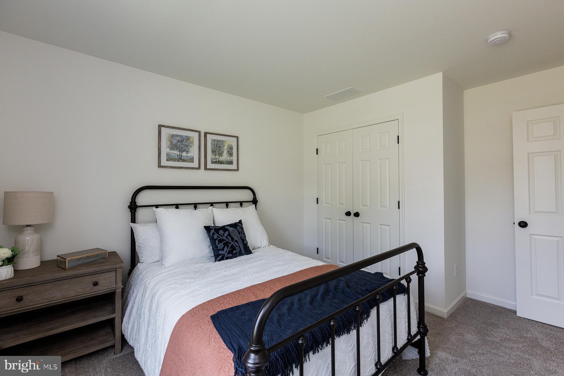 10 Ridgewood Road Quarryville, PA 17566 - Photo 34 of 48 a bedroom with a bed and a night stand