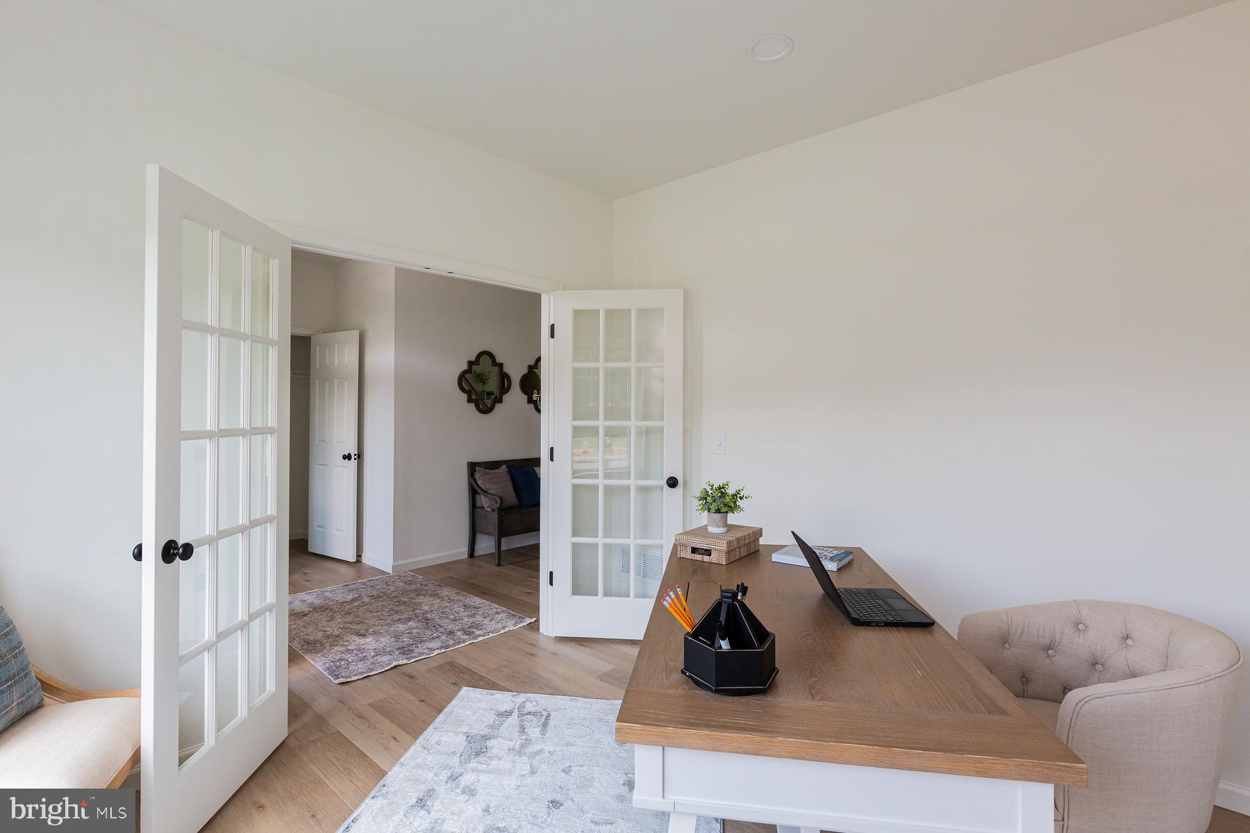 10 Ridgewood Road Quarryville, PA 17566 - Photo 7 of 48 a living room with furniture and a wooden floor