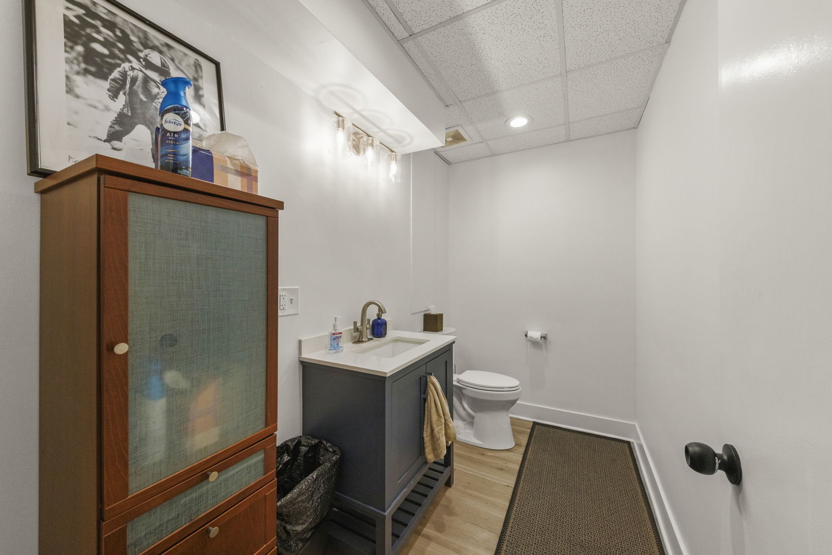 175 North Washington Street Wheaton, IL 60187 - Photo 12 of 14 a bathroom with a toilet a sink and glass door